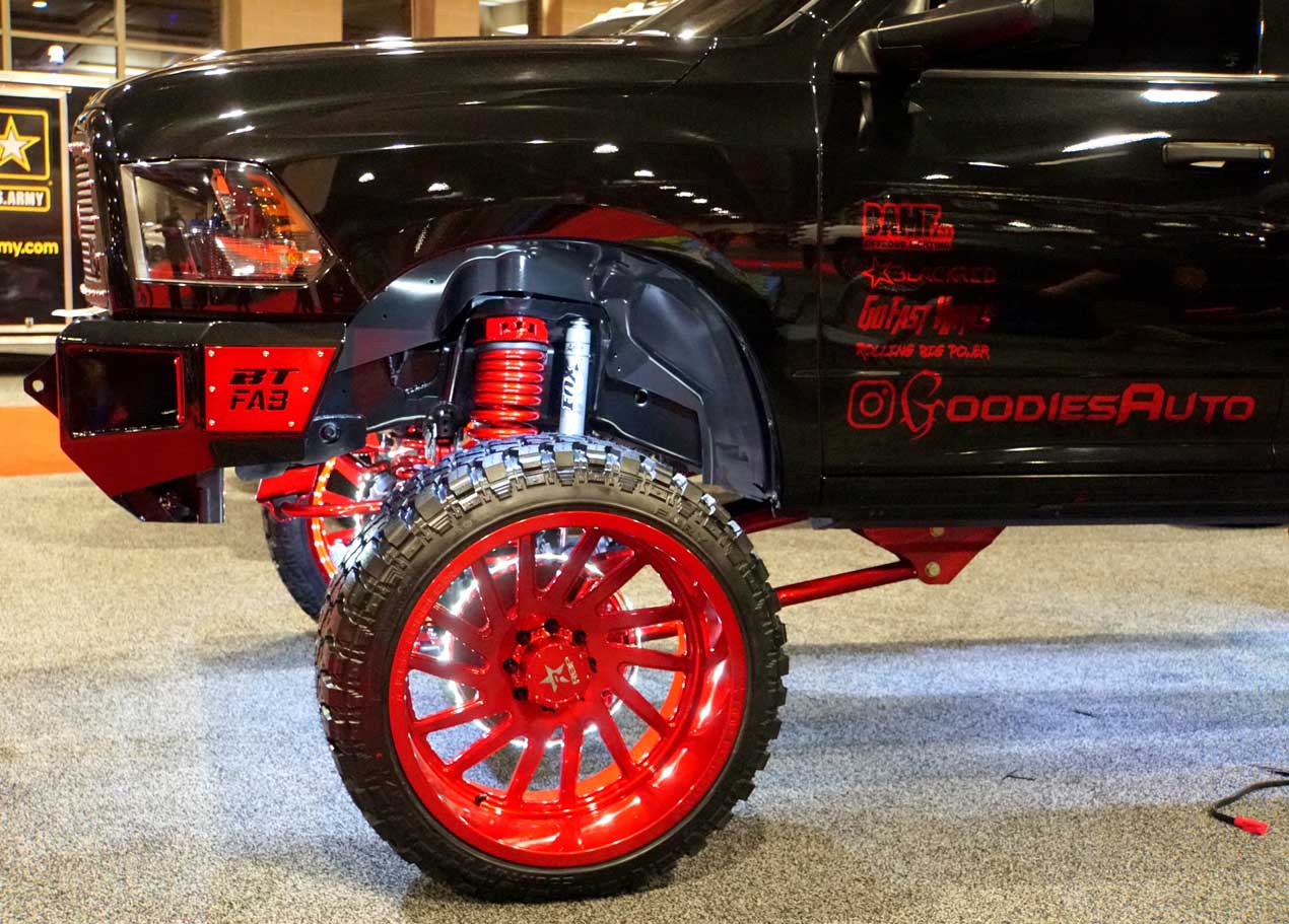 A Black Truck With Suspension Lift Kit